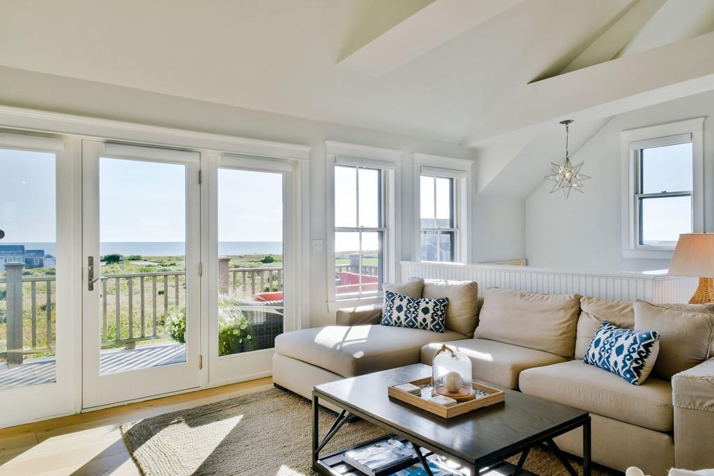 51 Madequecham Valley Road Nantucket, MA 02554 - Photo 10 of 25 a living room with furniture and a large window