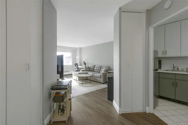 a view of living room with furniture and wooden floor