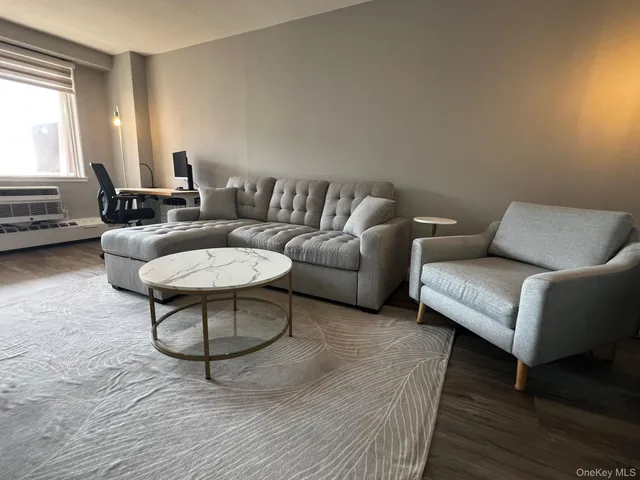 a living room with furniture and a couch