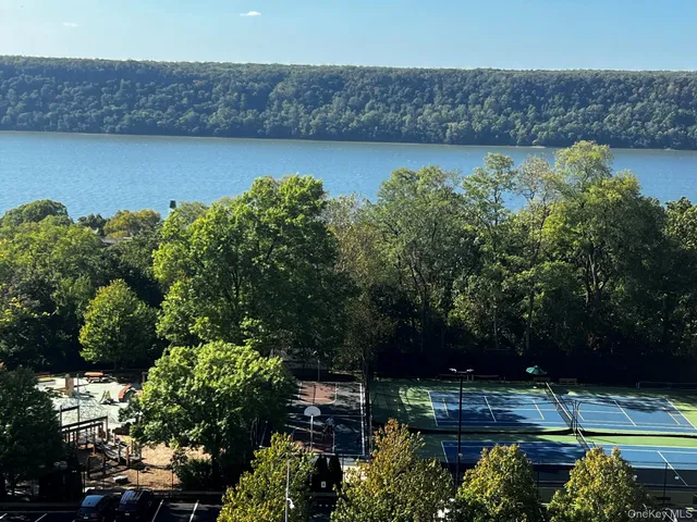 a view of a house with a yard and a garden