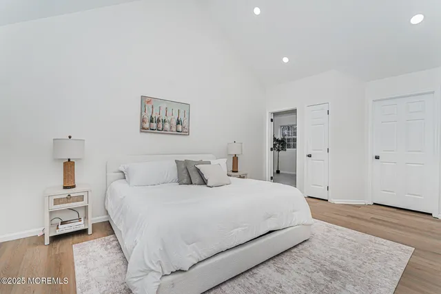 a bedroom with a large bed and a couch