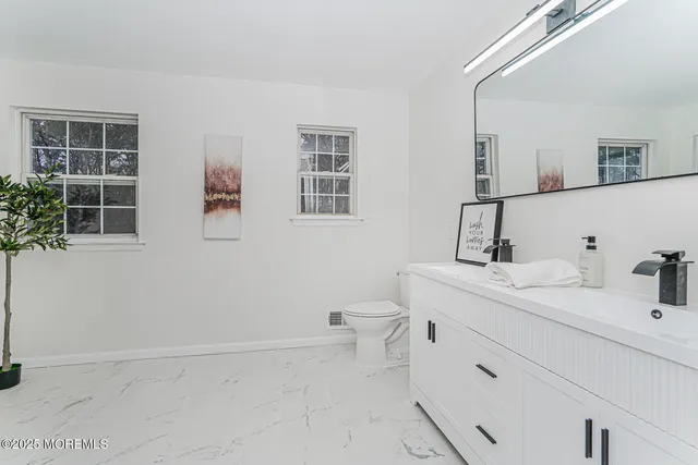 a bathroom with a toilet sink and bathtub