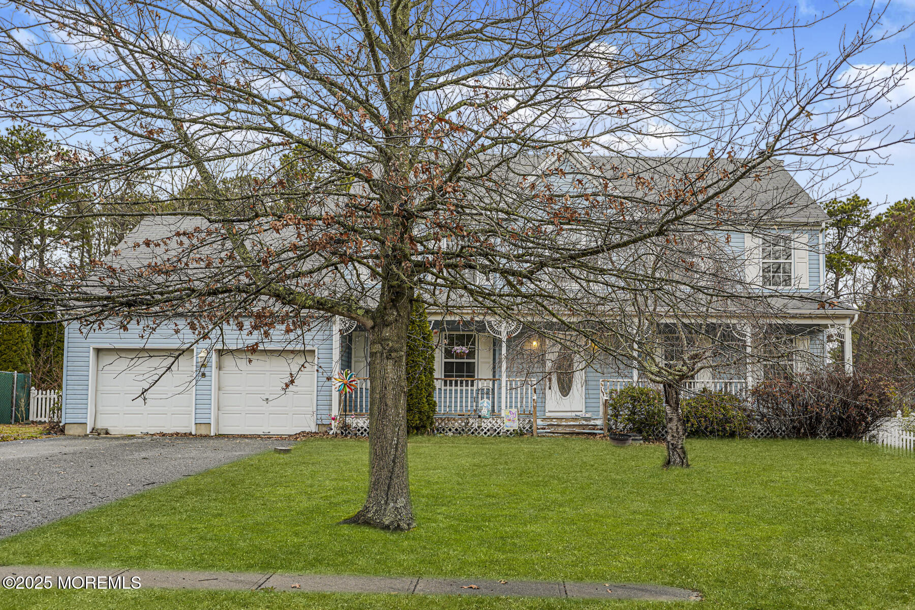 7 Willow Tree Court Barnegat, NJ 08005 - Photo 3 of 44 a white house that has a tree in front of it