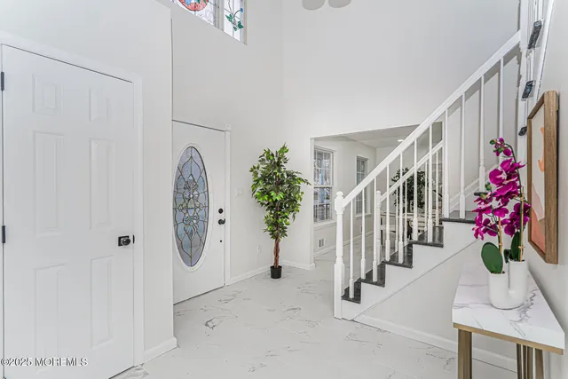 a view of entryway with wooden floor