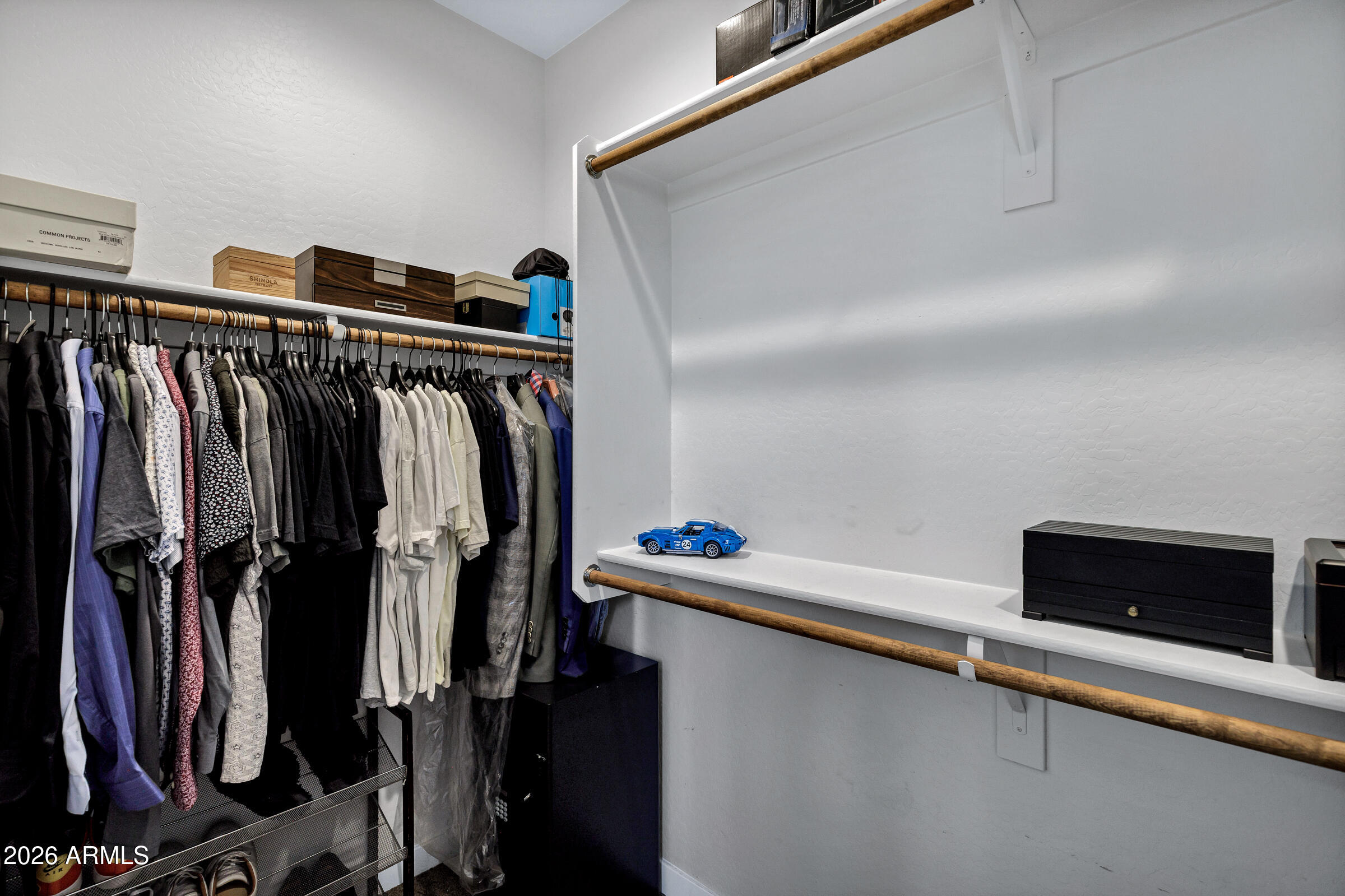 12243 East Sereno Road Gold Canyon, AZ 85118 - Photo 19 of 37 a view of walk in closet with clothes and shoes