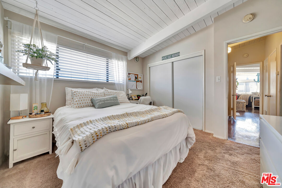 110 Paseo De La Concha Redondo Beach, CA 90277 - Photo 8 of 14 a bedroom with bed and a chandelier