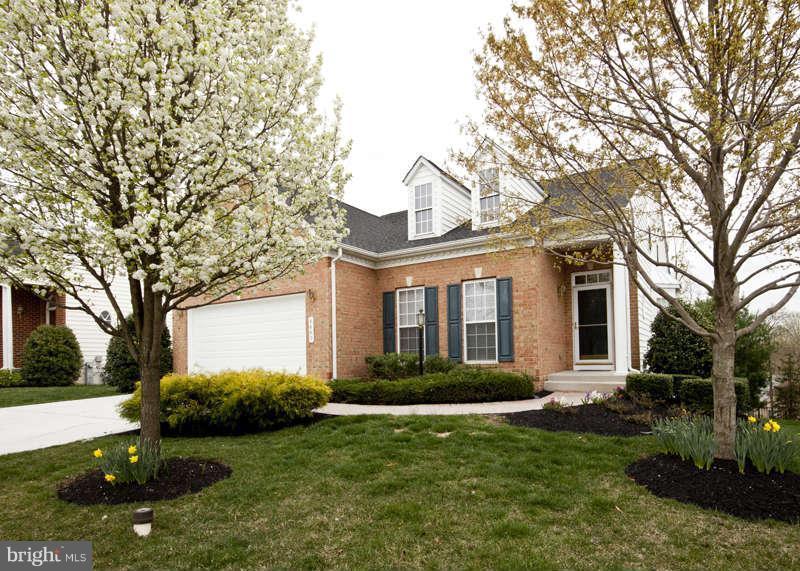 8603 Snowreath Road, Unit 8603 Baltimore, MD 21208 - Photo 1 of 30 a front view of a house with a garden
