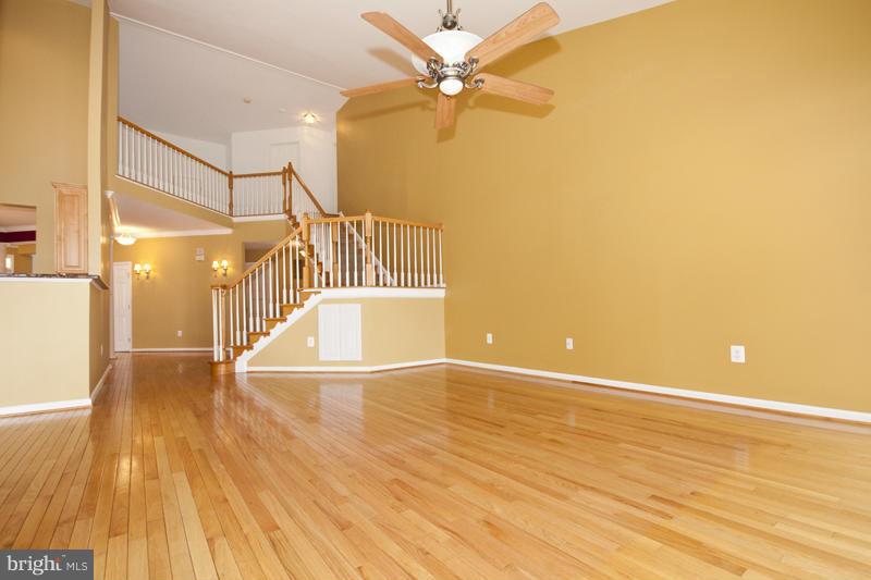 8603 Snowreath Road, Unit 8603 Baltimore, MD 21208 - Photo 11 of 30 wooden floor in an empty room with a window