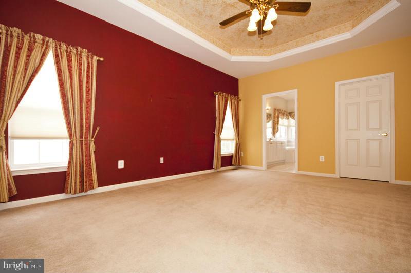 8603 Snowreath Road, Unit 8603 Baltimore, MD 21208 - Photo 15 of 30 an empty room with windows and entrance