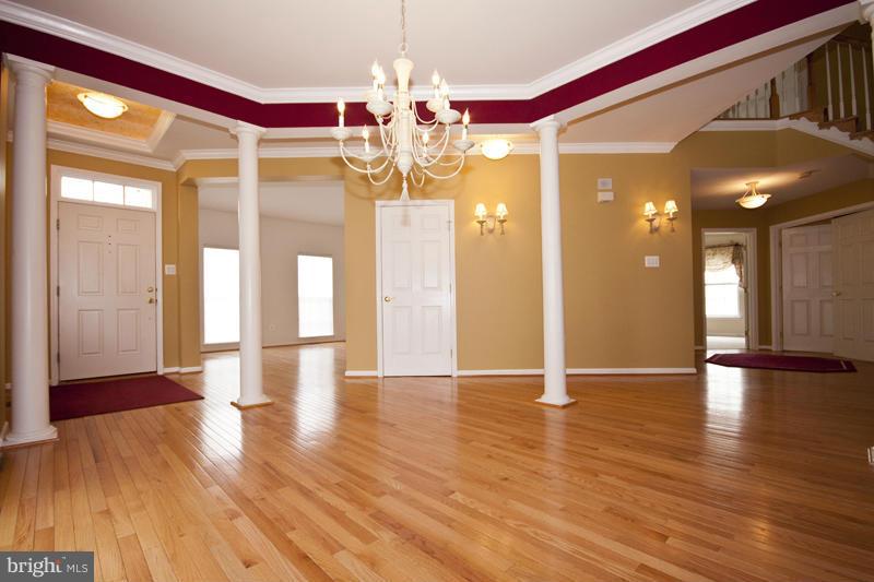 8603 Snowreath Road, Unit 8603 Baltimore, MD 21208 - Photo 3 of 30 a view of empty room with wooden floor and fan
