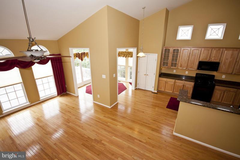 8603 Snowreath Road, Unit 8603 Baltimore, MD 21208 - Photo 25 of 30 a view of a living room with furniture and a fireplace