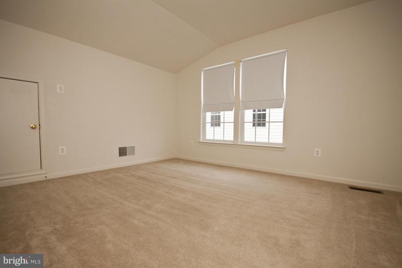 8603 Snowreath Road, Unit 8603 Baltimore, MD 21208 - Photo 29 of 30 an empty room with windows