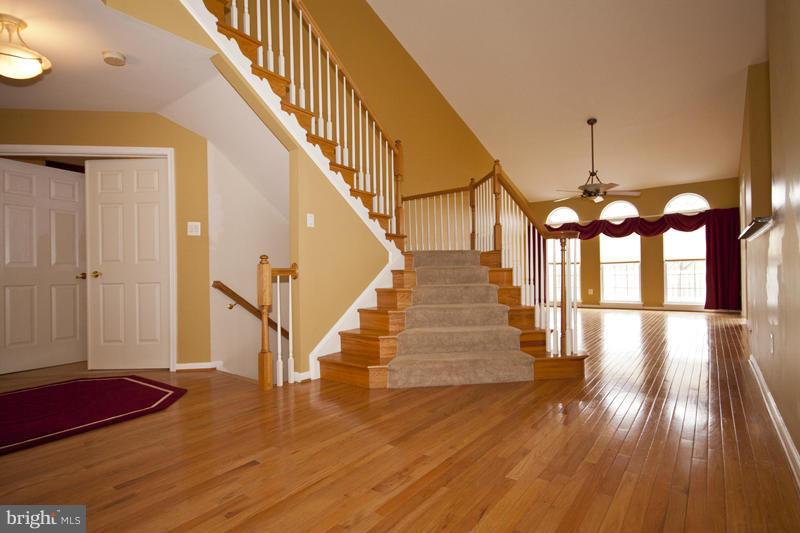 8603 Snowreath Road, Unit 8603 Baltimore, MD 21208 - Photo 4 of 30 a view of entryway and hall with wooden floor