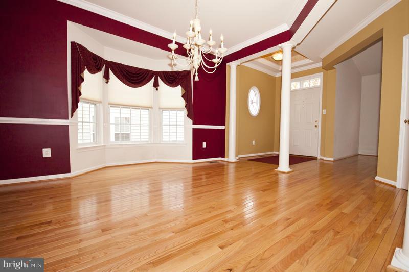 8603 Snowreath Road, Unit 8603 Baltimore, MD 21208 - Photo 5 of 30 a view of an empty room with window and hardwood floor