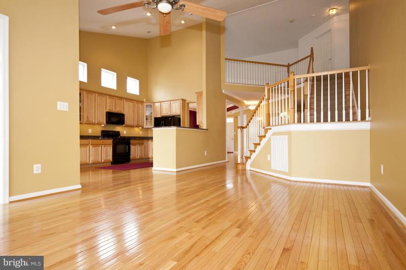 8603 Snowreath Road, Unit 8603 Baltimore, MD 21208 - Photo 10 of 30 a view of a living room with furniture and wooden floor