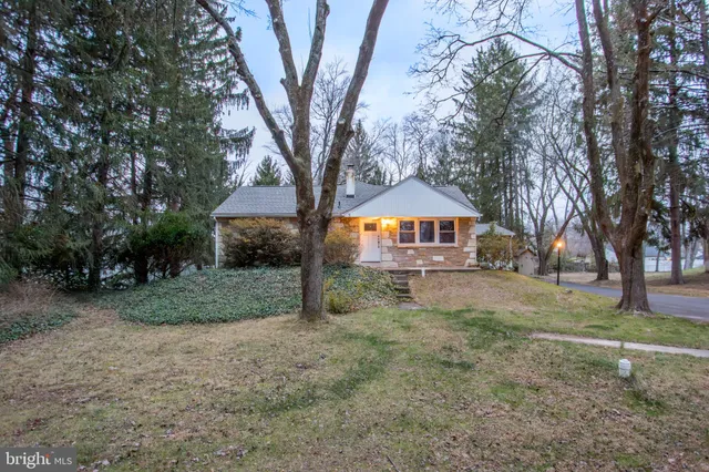 a house with trees in the background