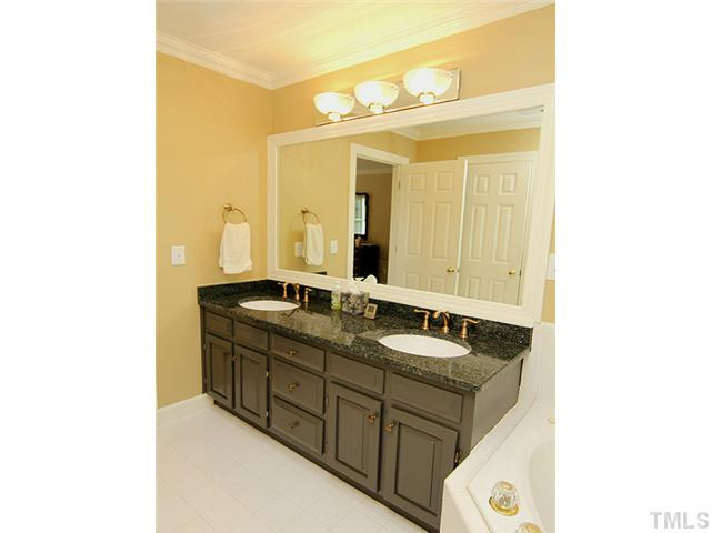 6321 Ashley Ridge Drive Raleigh, NC 27612 - Photo 13 of 24 Nice Master Bath with granite, dual-sink vanity and updated plumbing and lighting fixtures. Master Bath/Spa