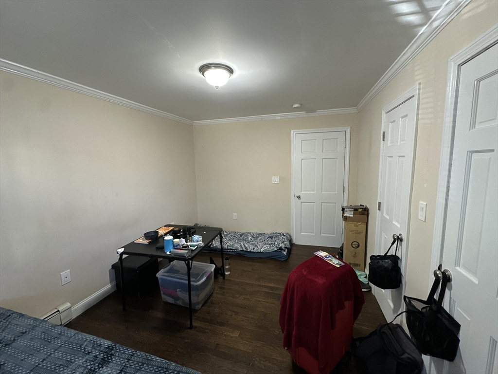 435 Walnut Avenue, Unit A Boston, MA 02119 - Photo 8 of 12 a living room with furniture