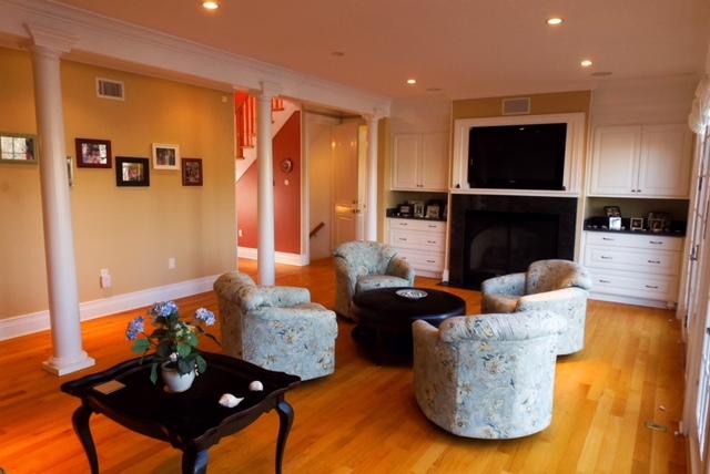 194 Fells Pond Road Mashpee, MA 02649 - Photo 12 of 34 a living room with fireplace furniture and a flat screen tv