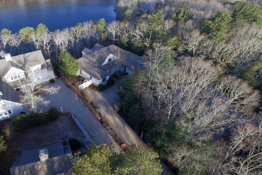 194 Fells Pond Road Mashpee, MA 02649 - Photo 4 of 34 an aerial view of a house with a yard