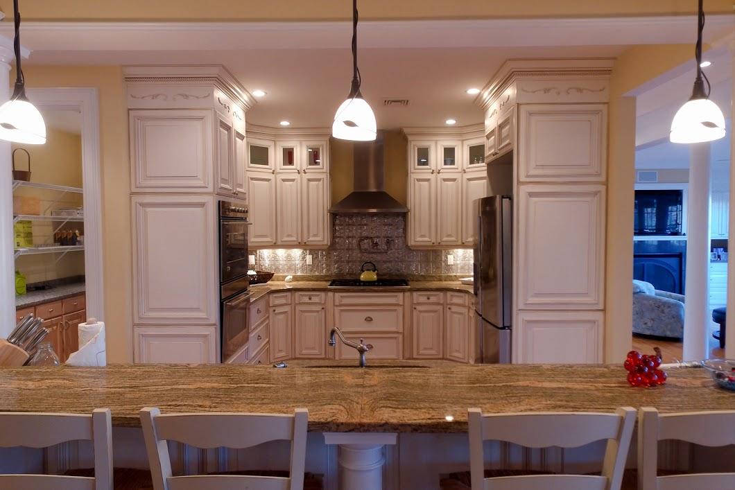 194 Fells Pond Road Mashpee, MA 02649 - Photo 6 of 34 a kitchen with stainless steel appliances granite countertop a stove refrigerator and cabinets