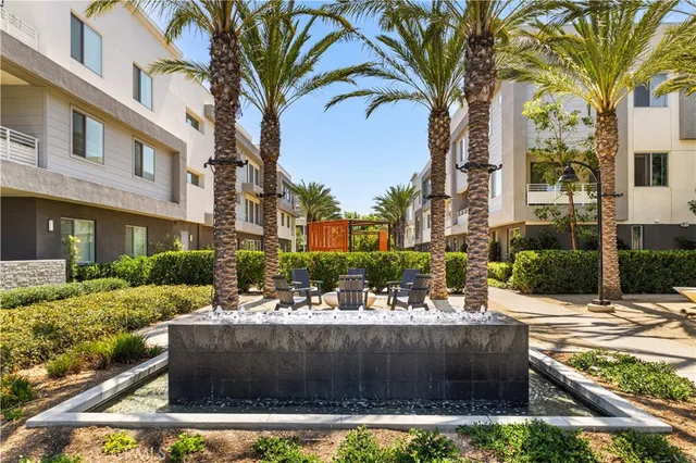a view of a house with a yard and tree s
