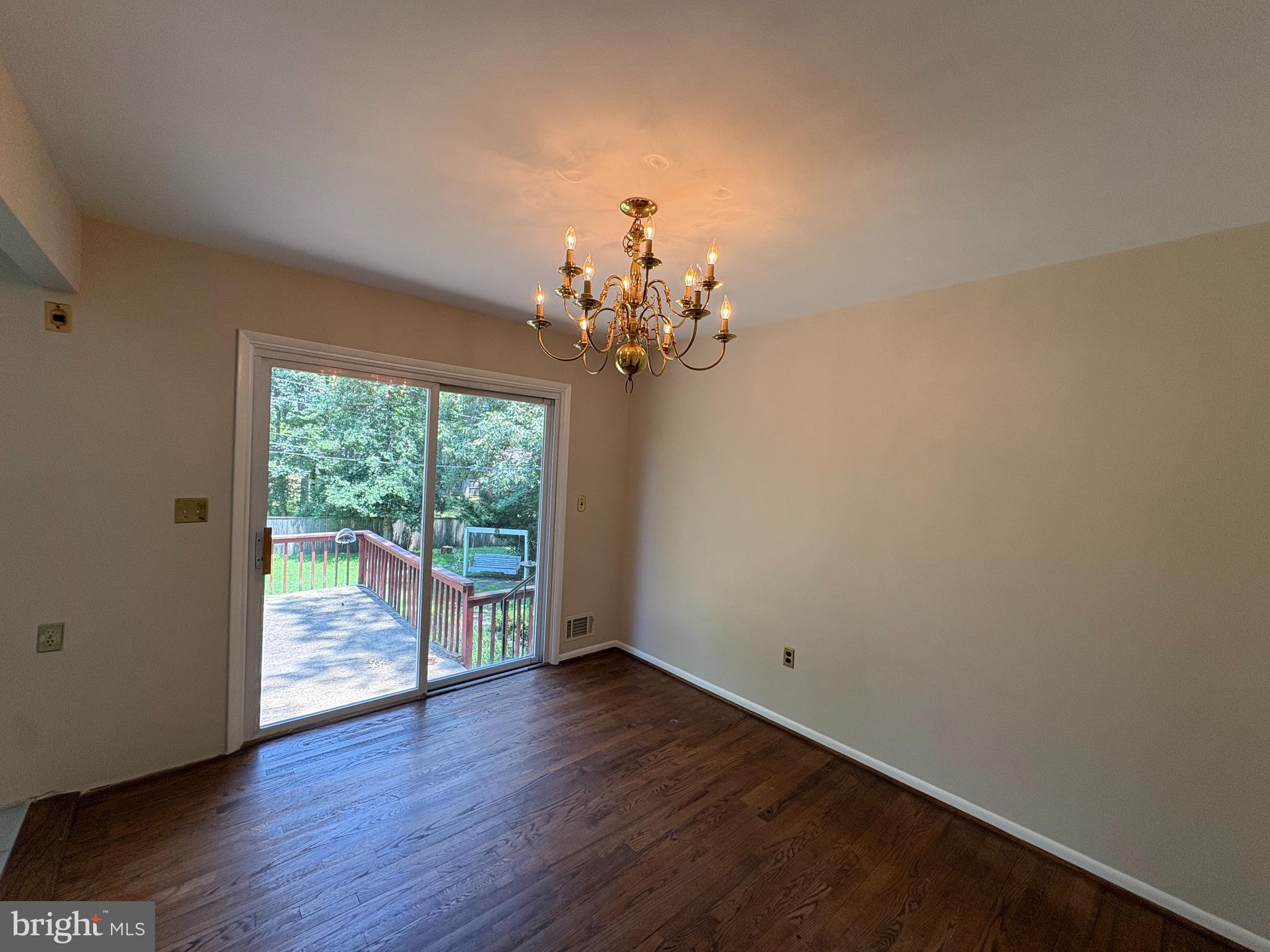 1554 Long Point Road Pasadena, MD 21122 - Photo 12 of 27 a view of a room with wooden floor and large window