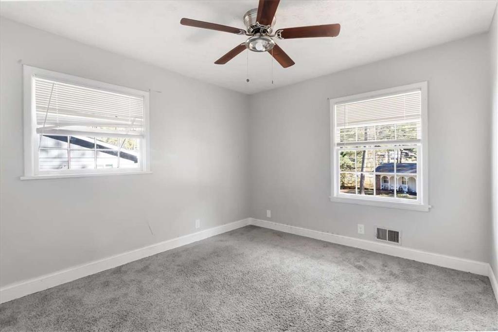 1999 Lindsey Lane Decatur, GA 30035 - Photo 20 of 38 a view of an empty room with a window