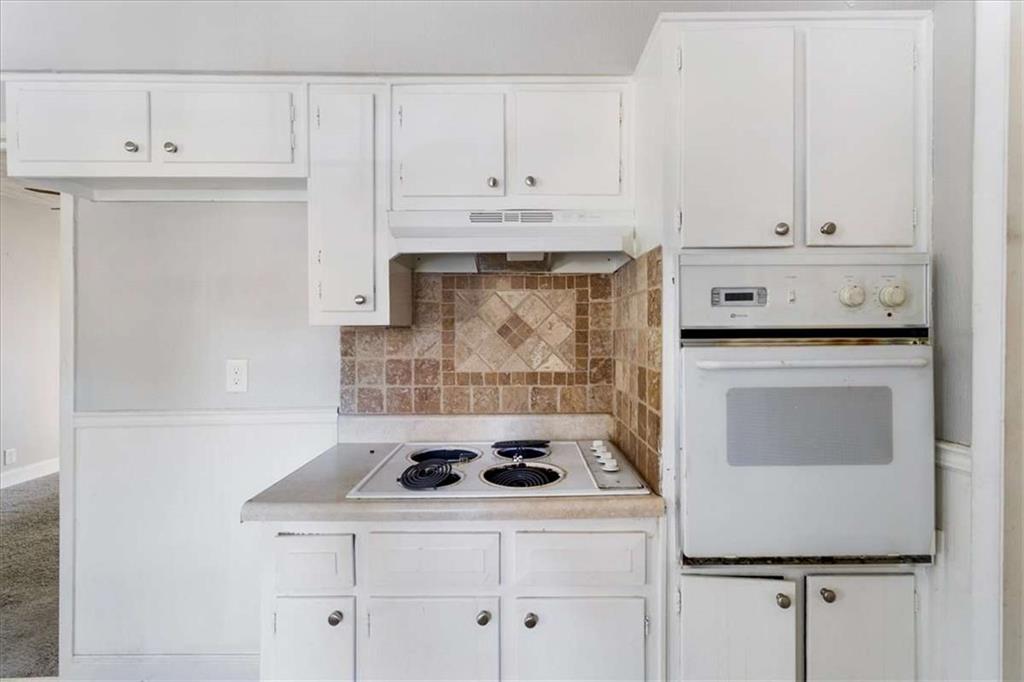 1999 Lindsey Lane Decatur, GA 30035 - Photo 10 of 38 a kitchen with white cabinets and white appliances