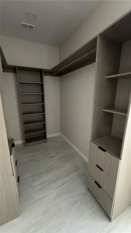 a view of an empty walk in closet