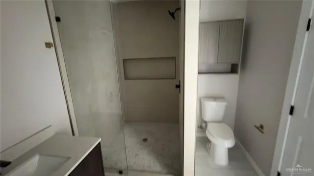 a bathroom with a granite countertop shower