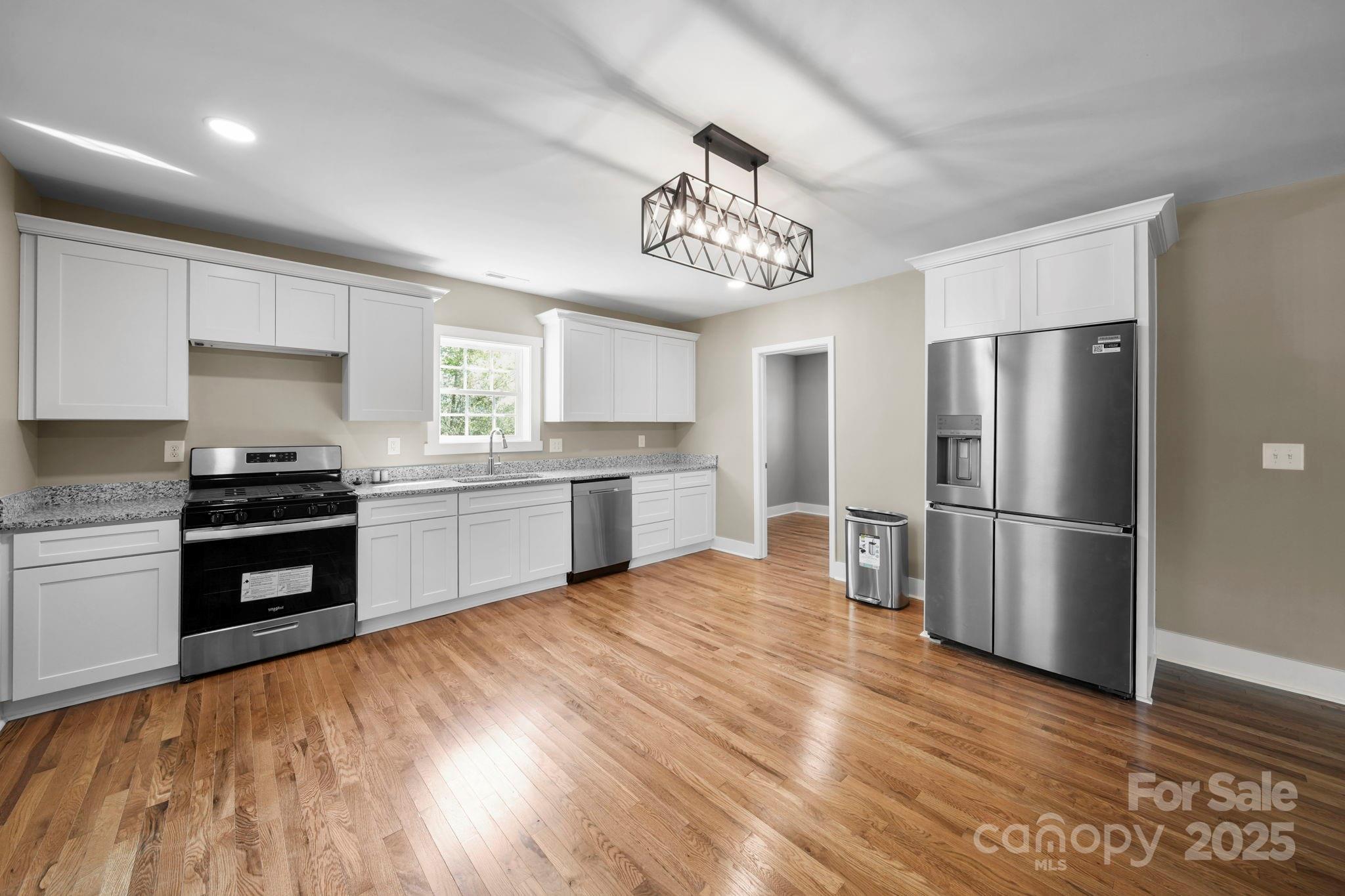 1048 Bowers Road Peachland, NC 28133 - Photo 16 of 44 a kitchen with a refrigerator and a stove top oven