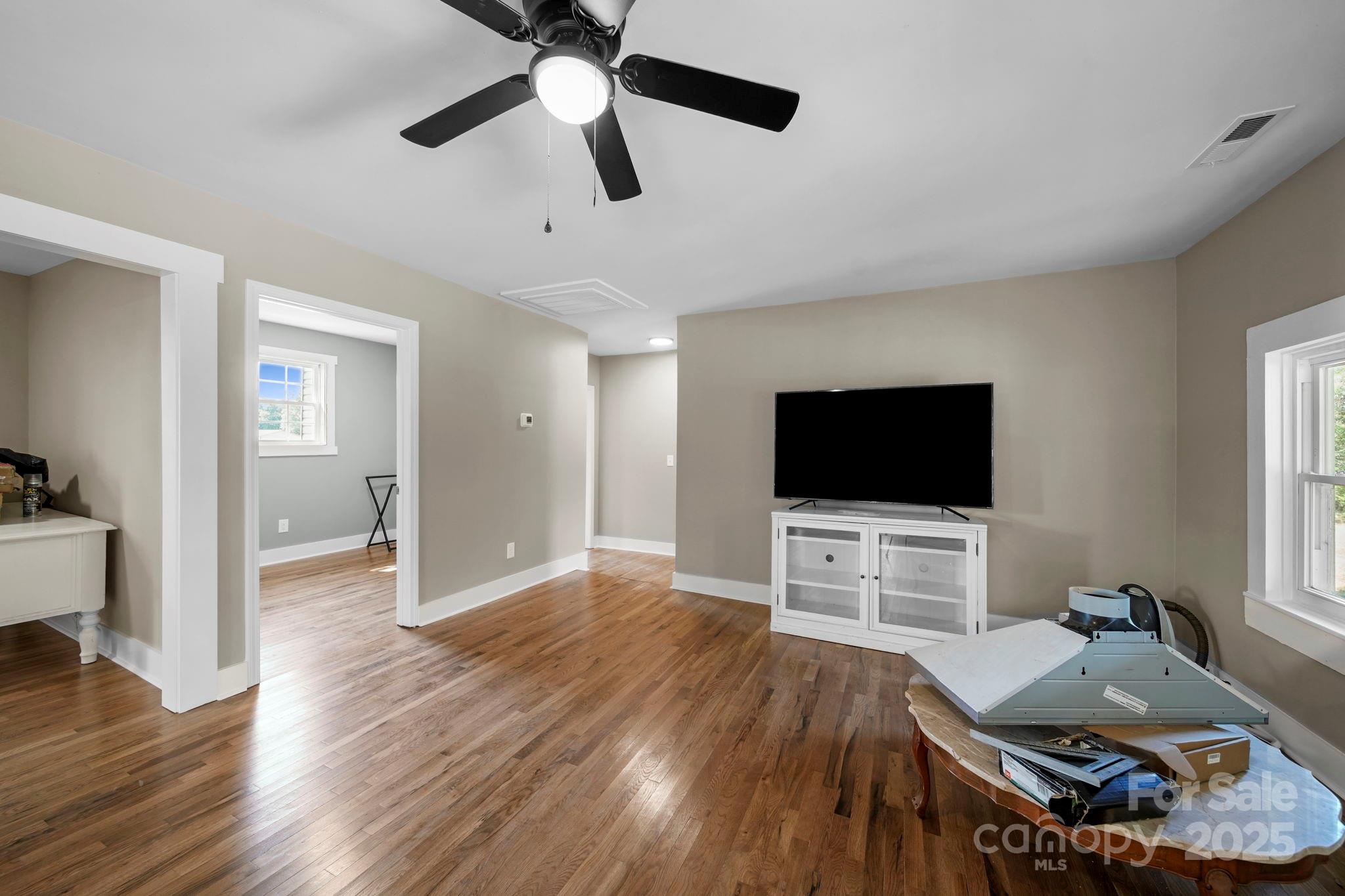 1048 Bowers Road Peachland, NC 28133 - Photo 21 of 44 a living room with furniture and a flat screen tv