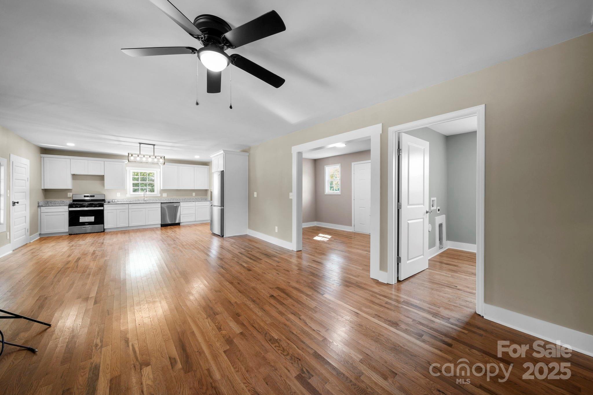 1048 Bowers Road Peachland, NC 28133 - Photo 22 of 44 a view of empty room with wooden floor and ceiling fan