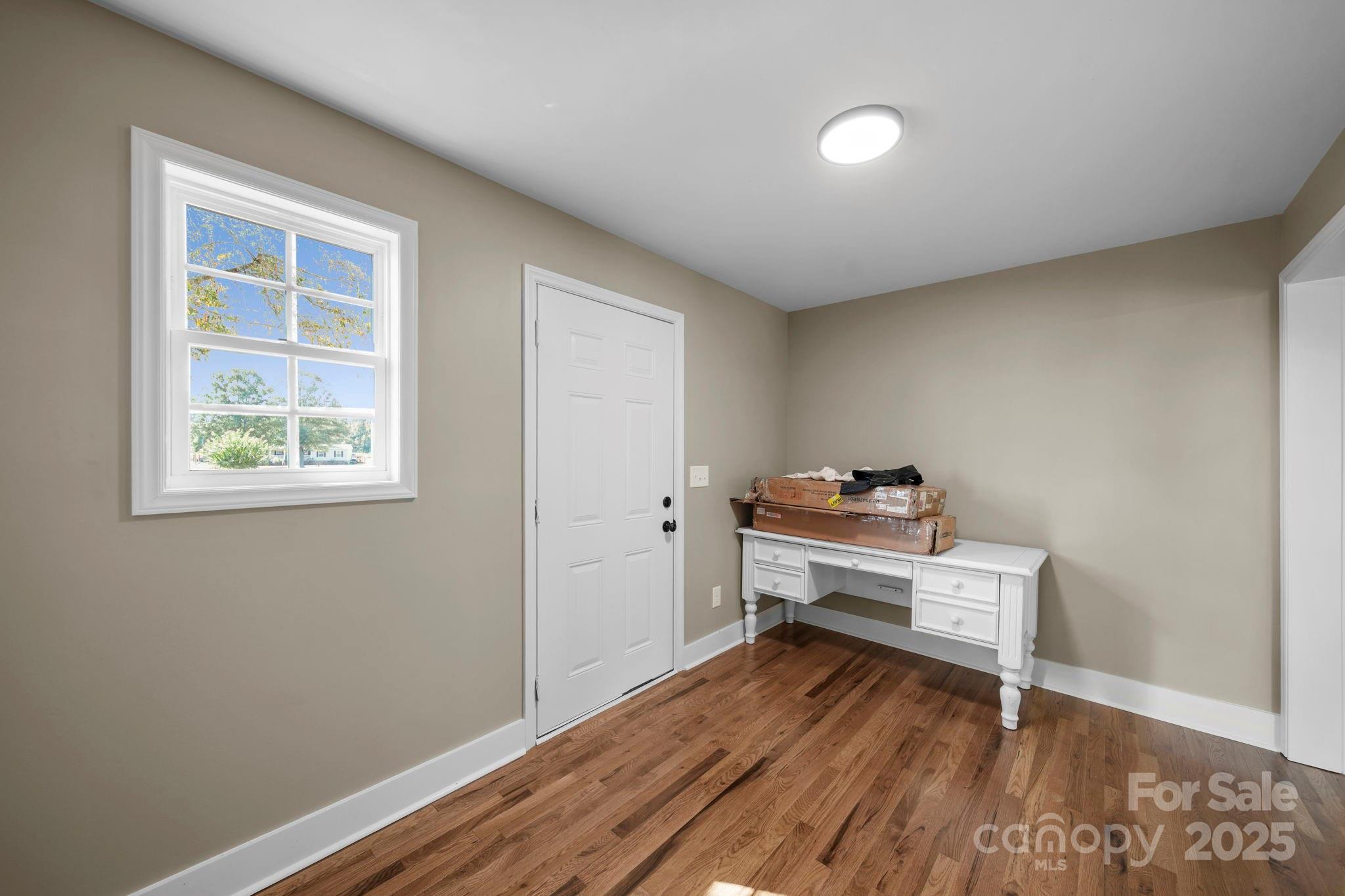 1048 Bowers Road Peachland, NC 28133 - Photo 26 of 44 a room with a wooden floor and a window