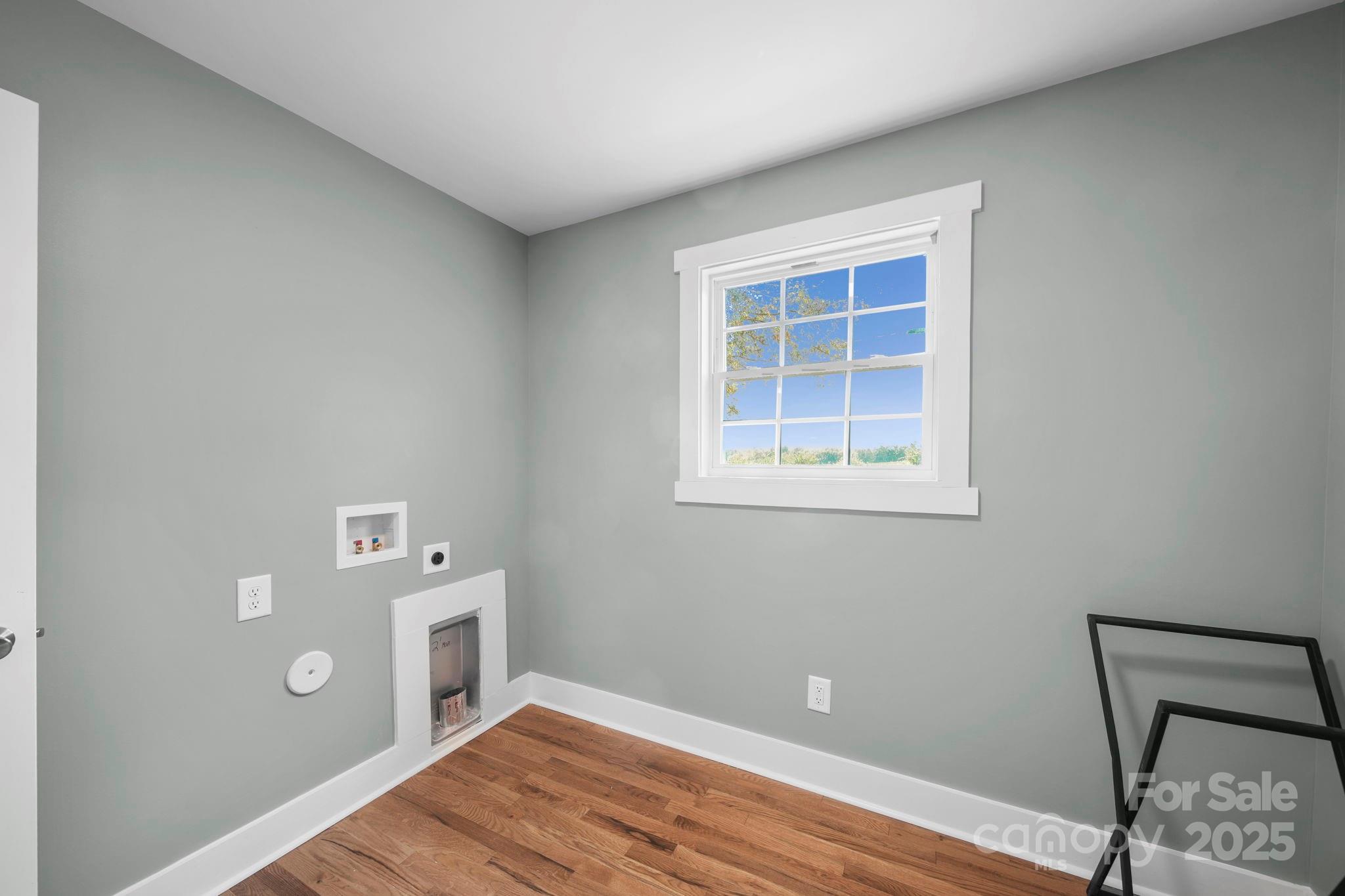 1048 Bowers Road Peachland, NC 28133 - Photo 30 of 44 a view of an empty room with window and wooden floor