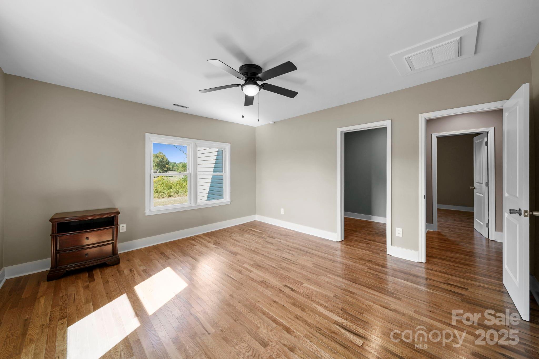 1048 Bowers Road Peachland, NC 28133 - Photo 35 of 44 a view of an empty room with window and wooden floor