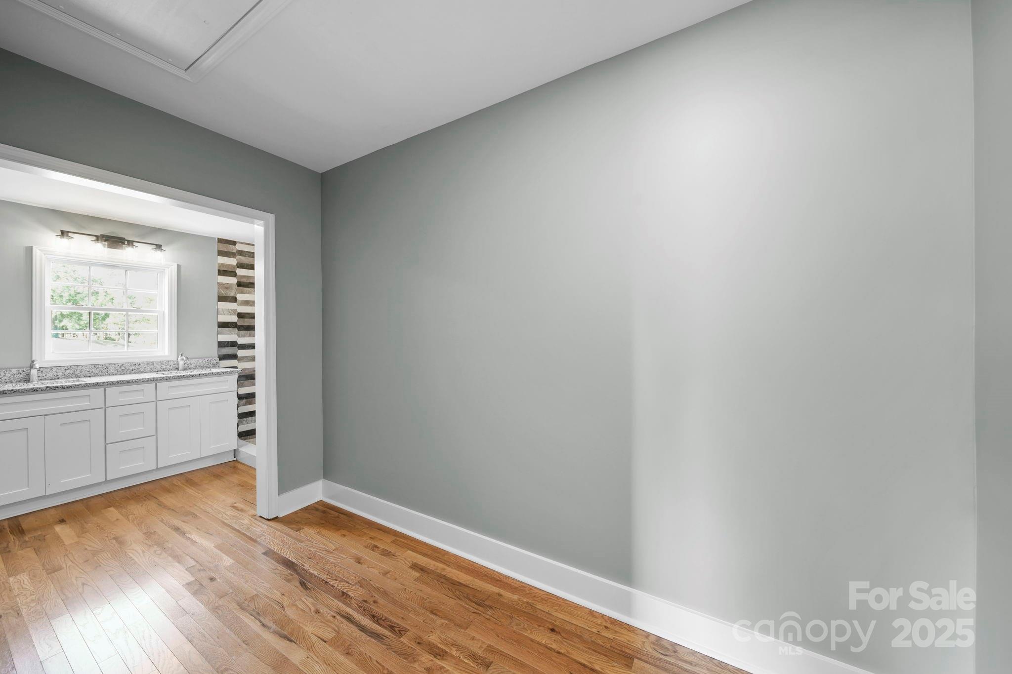 1048 Bowers Road Peachland, NC 28133 - Photo 38 of 44 a view of empty room with wooden floor and fan
