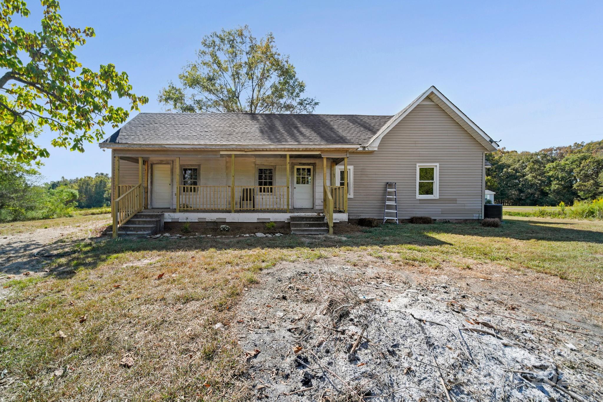 1048 Bowers Road Peachland, NC 28133 - Photo 4 of 44 a front view of house with yard and trees in the background