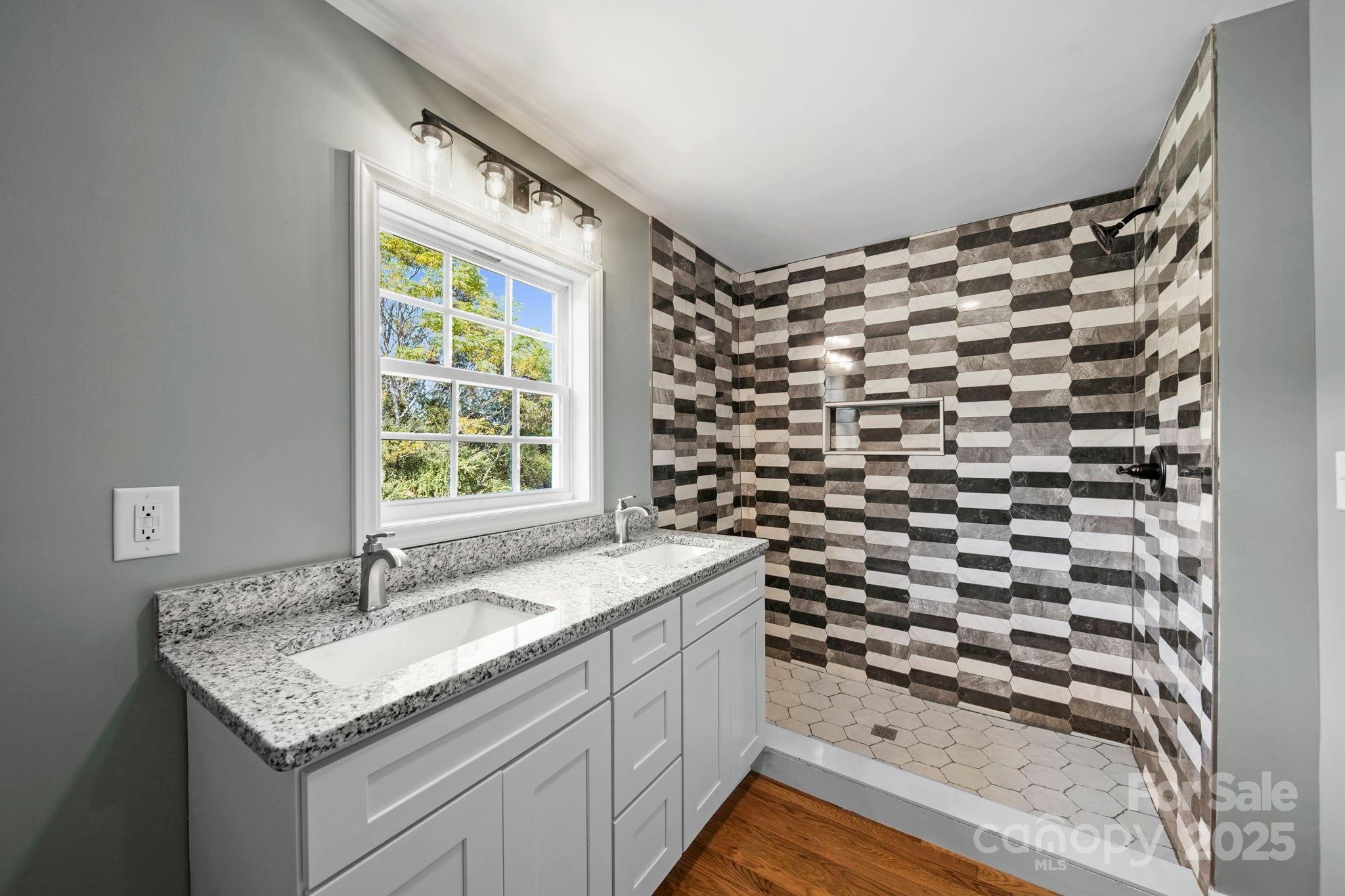 1048 Bowers Road Peachland, NC 28133 - Photo 41 of 44 a bathroom with a granite countertop sink and a mirror