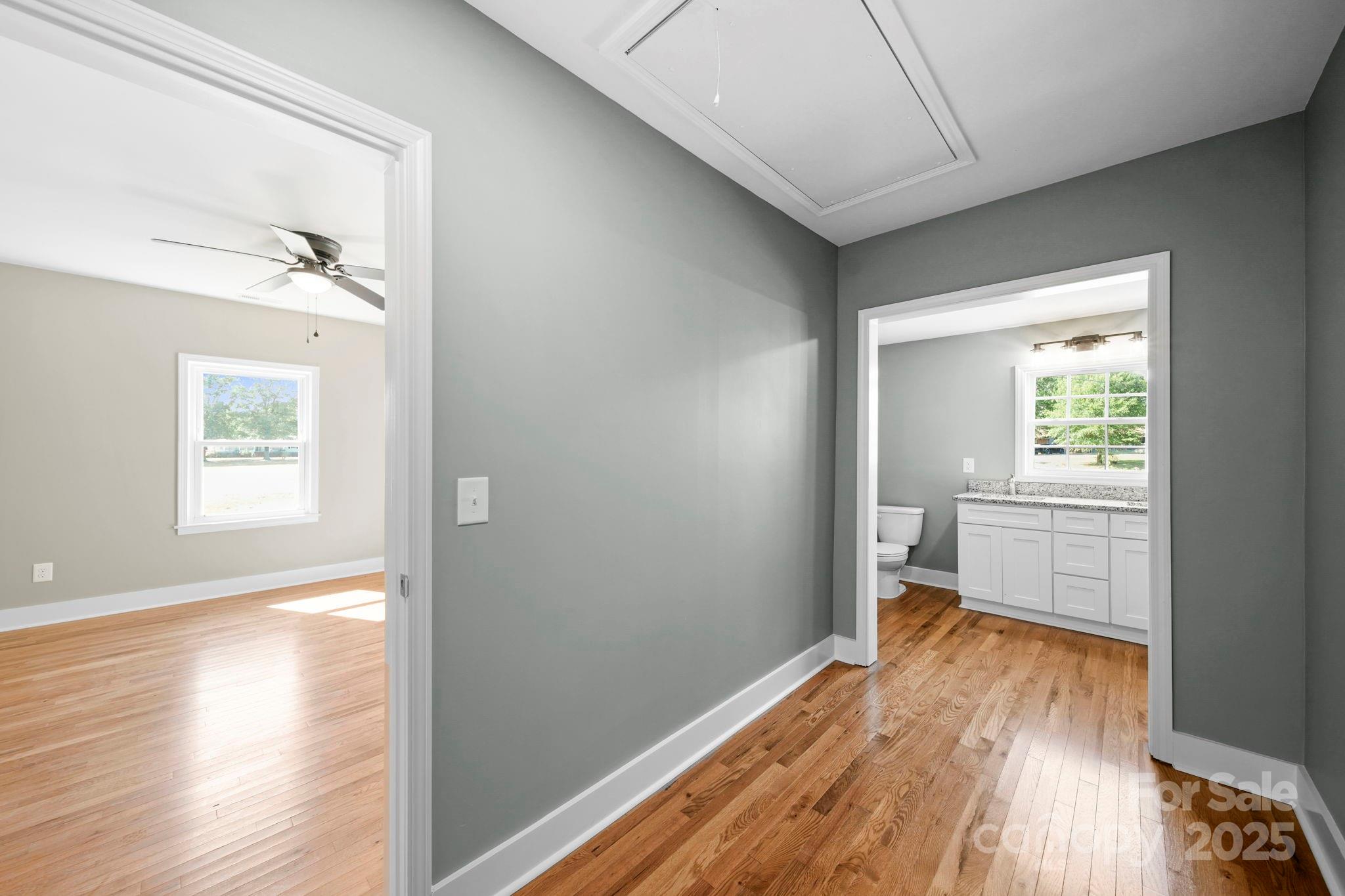 1048 Bowers Road Peachland, NC 28133 - Photo 42 of 44 a view of a hallway with wooden floor and a bathroom