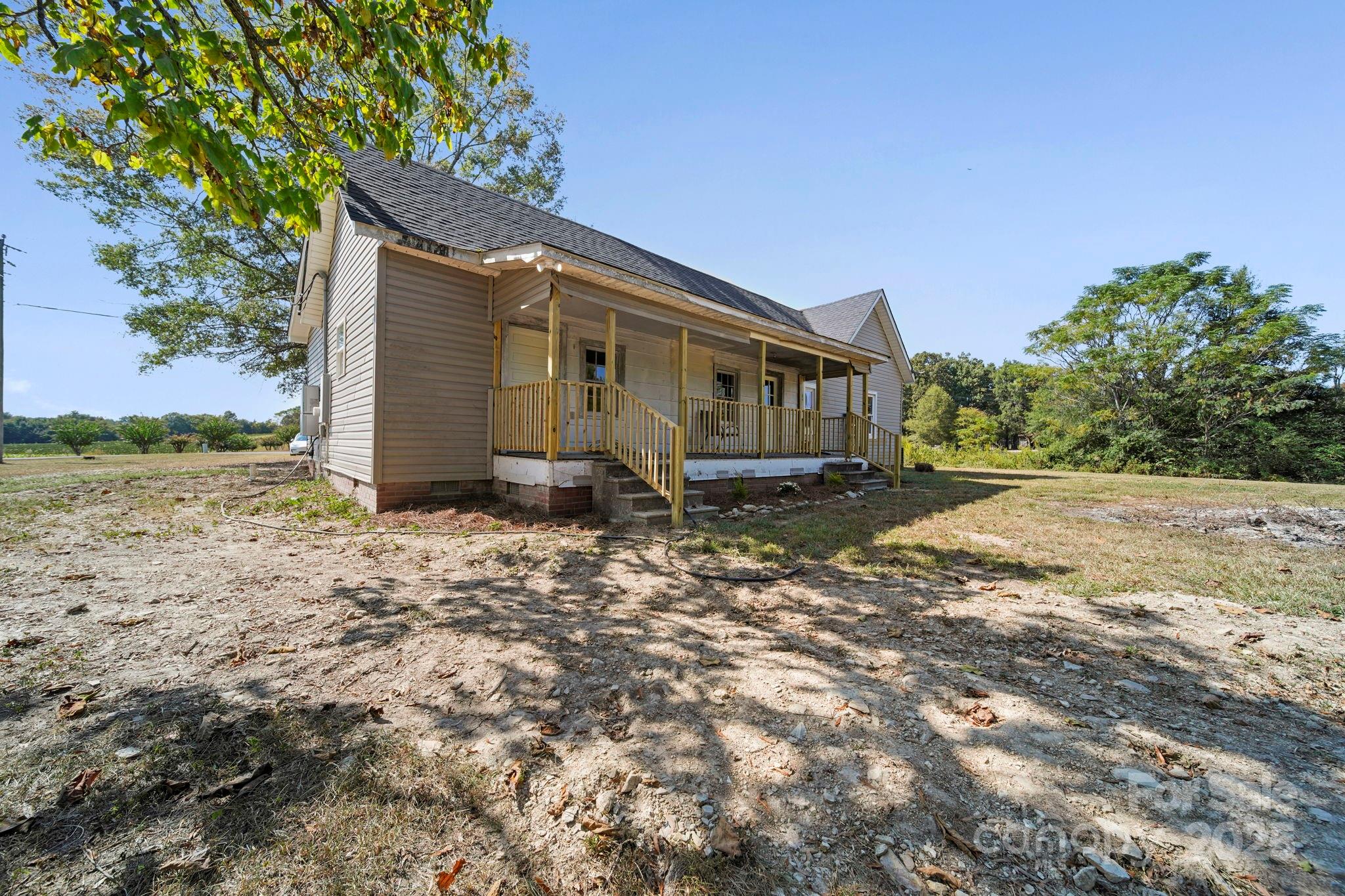 1048 Bowers Road Peachland, NC 28133 - Photo 6 of 44 a front view of a house with a yard