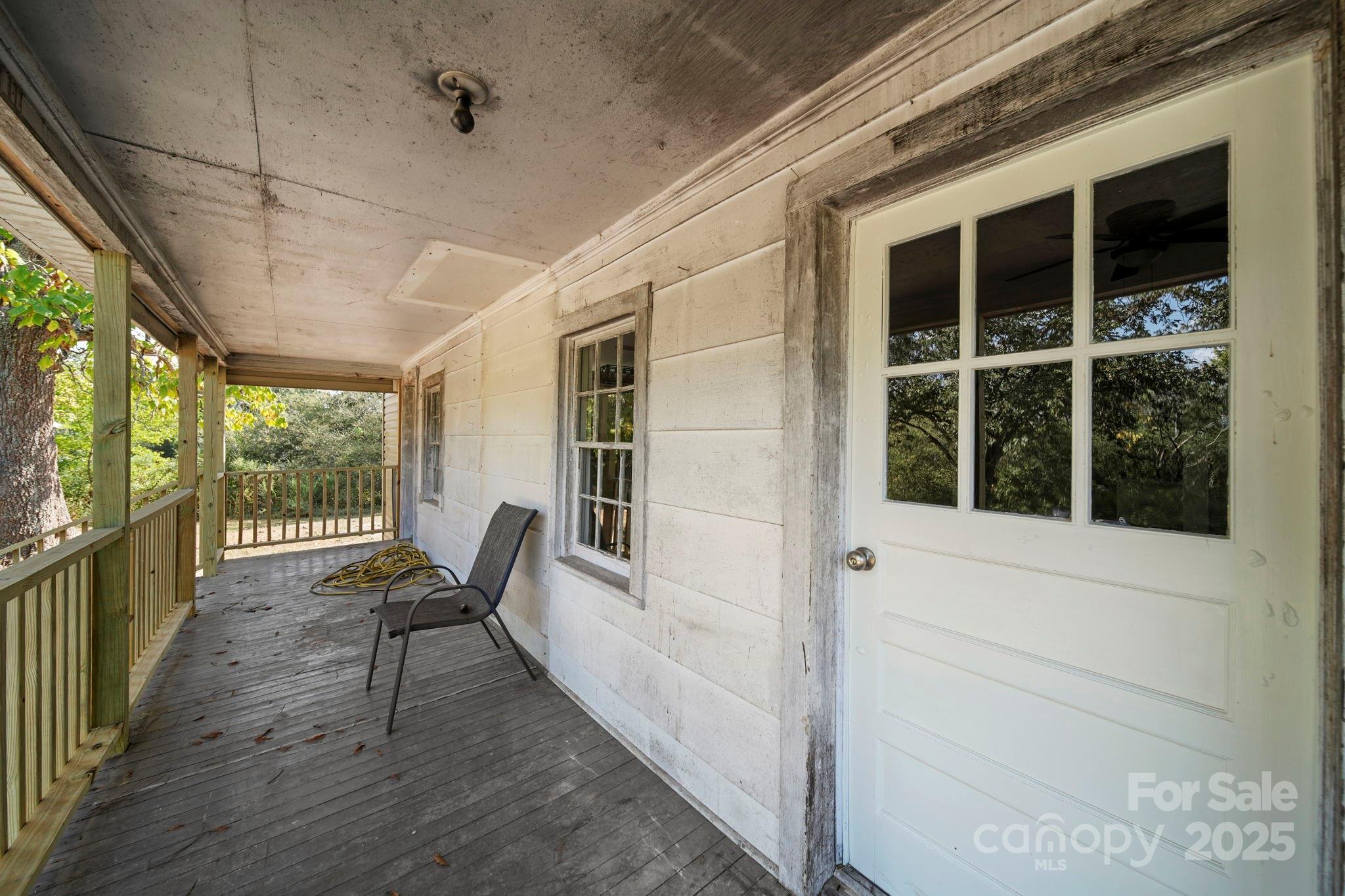 1048 Bowers Road Peachland, NC 28133 - Photo 7 of 44 a view of a porch with chairs and backyard