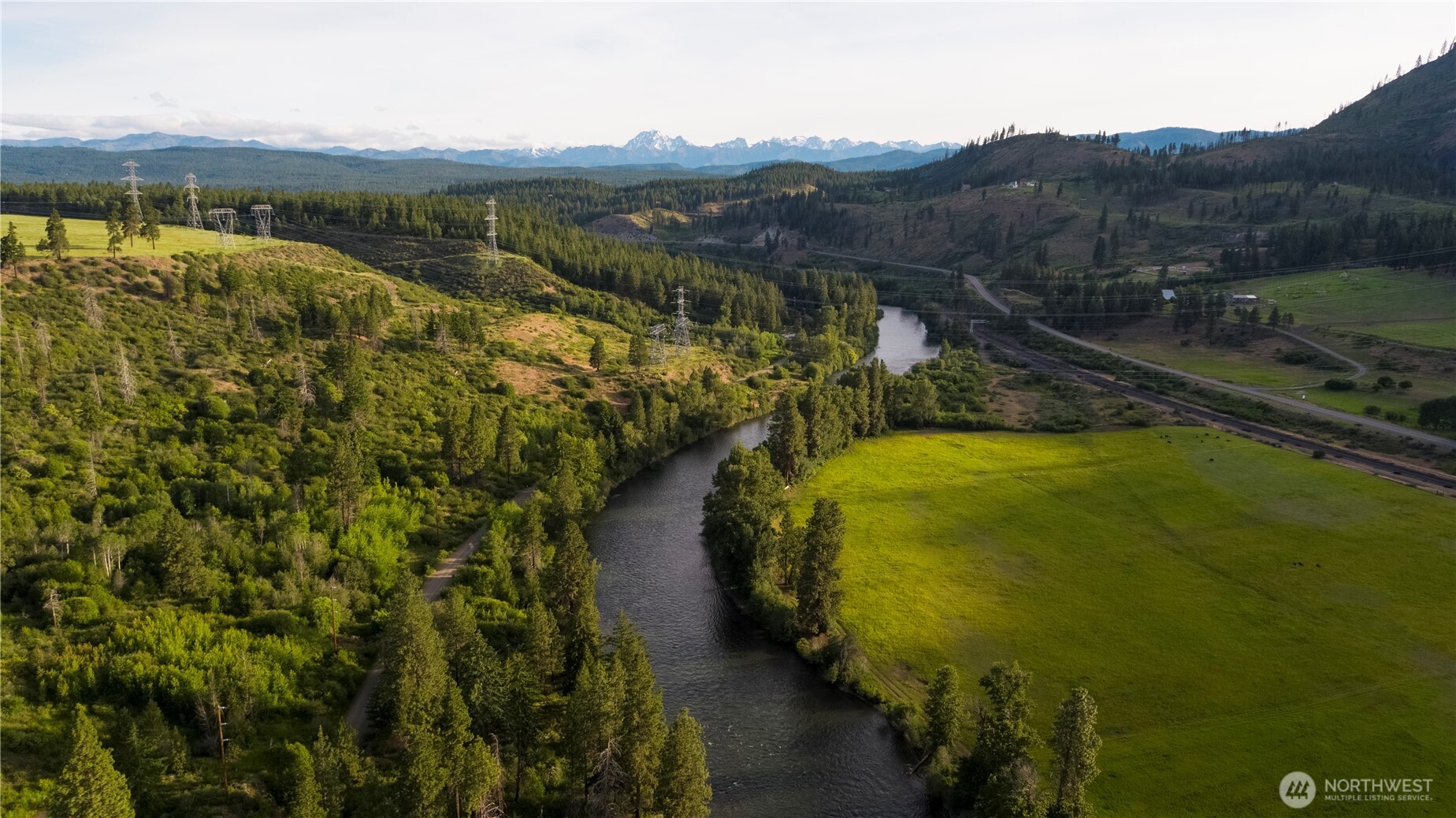 a view of a swimming pool with mountains in the background