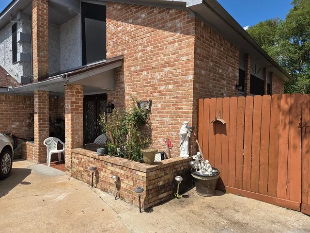 a view of a backyard with sitting area