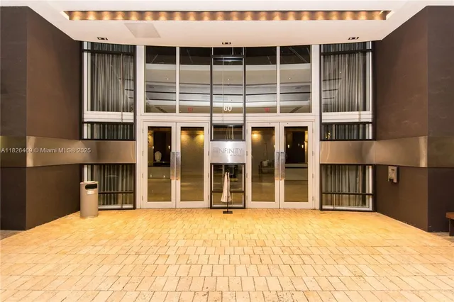 a living room with fish tank and a flat screen tv