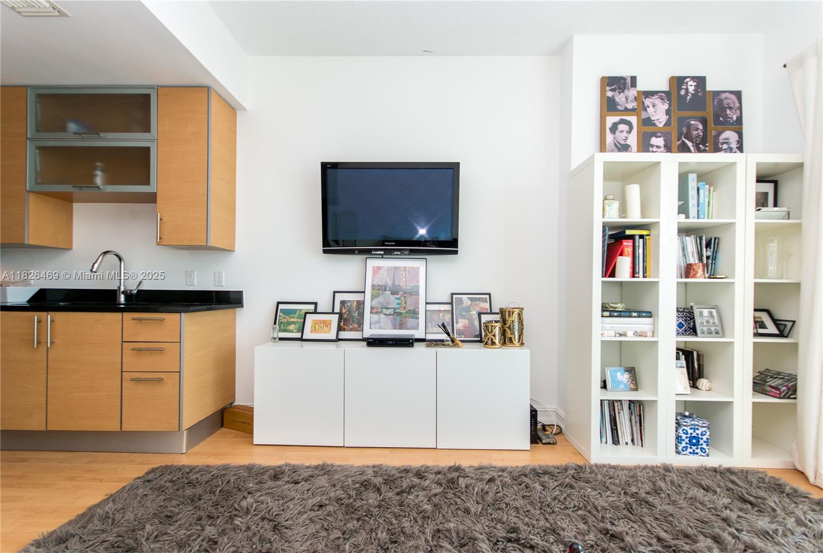 60 Southwest 13th Street, Unit 3805 Miami, FL 33130 - Photo 2 of 14 a living room with fish tank and a flat screen tv