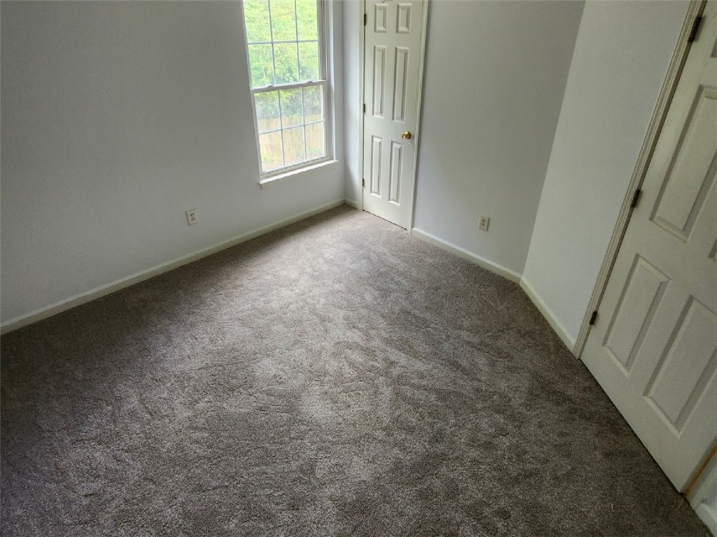 328 Springfield Circle Easley, SC 29642 - Photo 25 of 29 Newly installed, soft gray carpeting creates a welcoming atmosphere in this comfortable bedroom.
