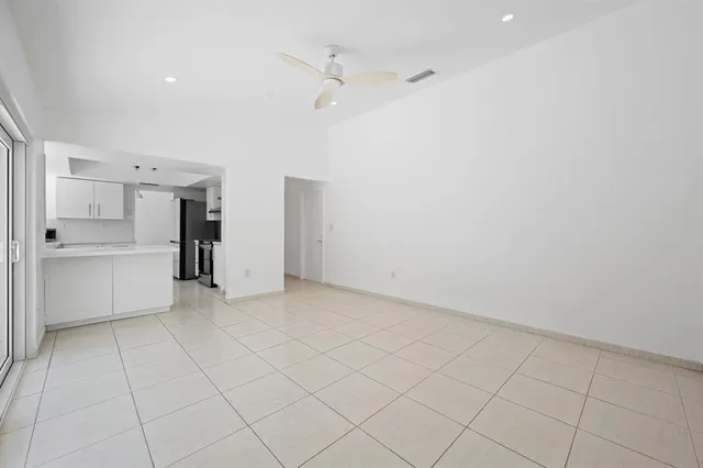 a view of a kitchen with a sink and dishwasher cabinets