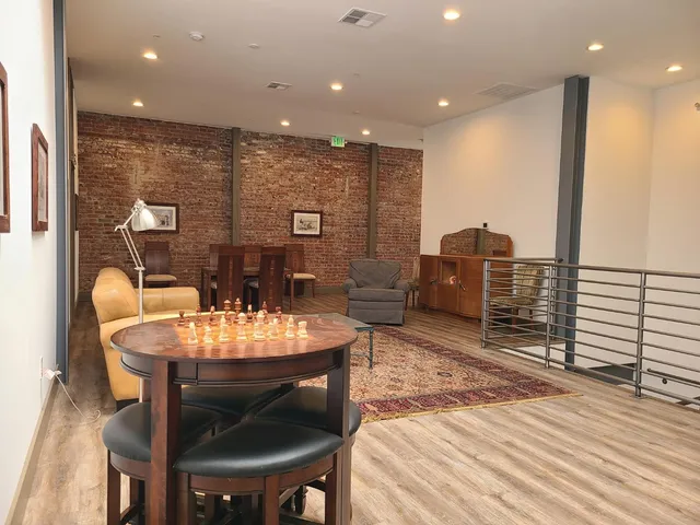 a large kitchen with a table and chairs